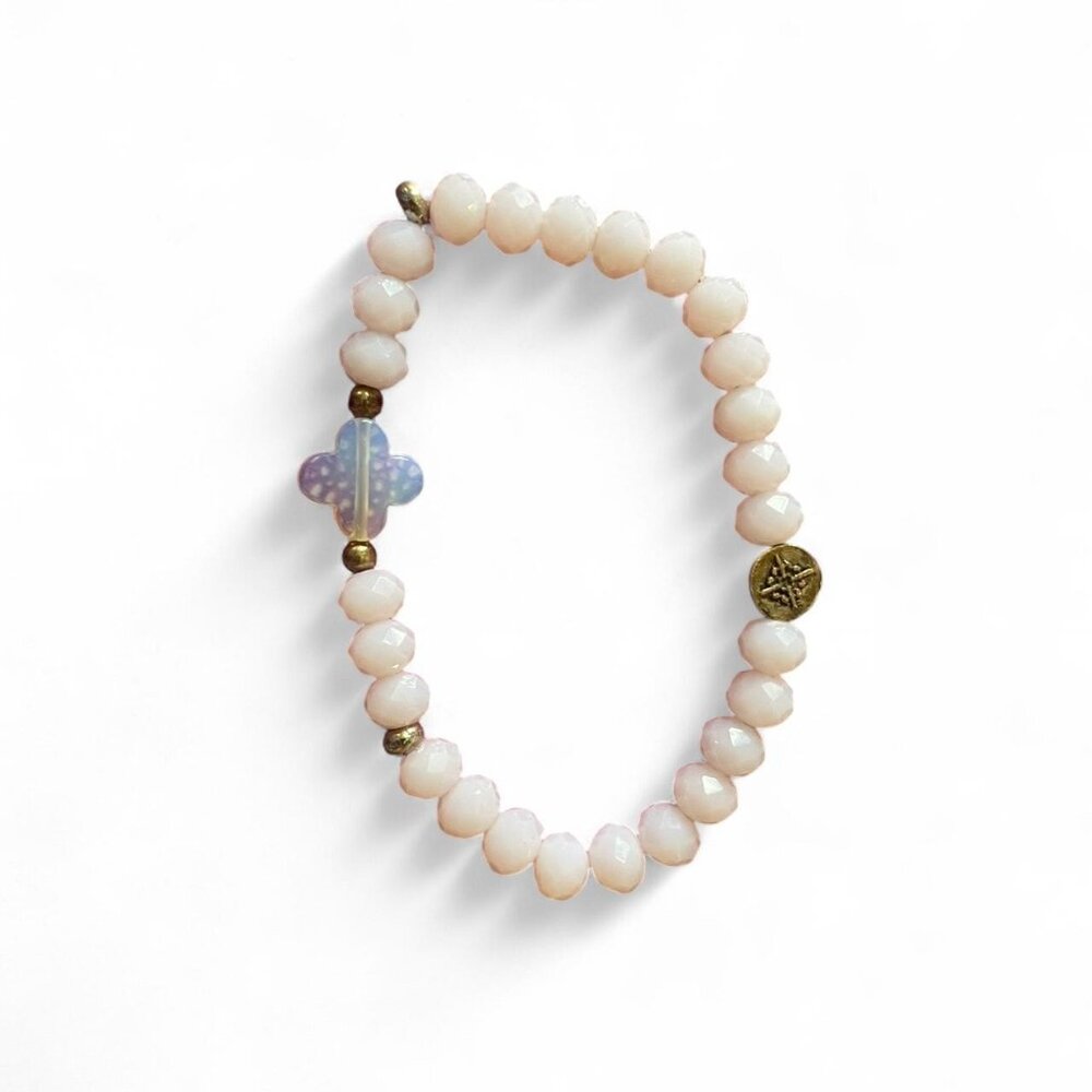 pink beaded bracelet with minimal charms